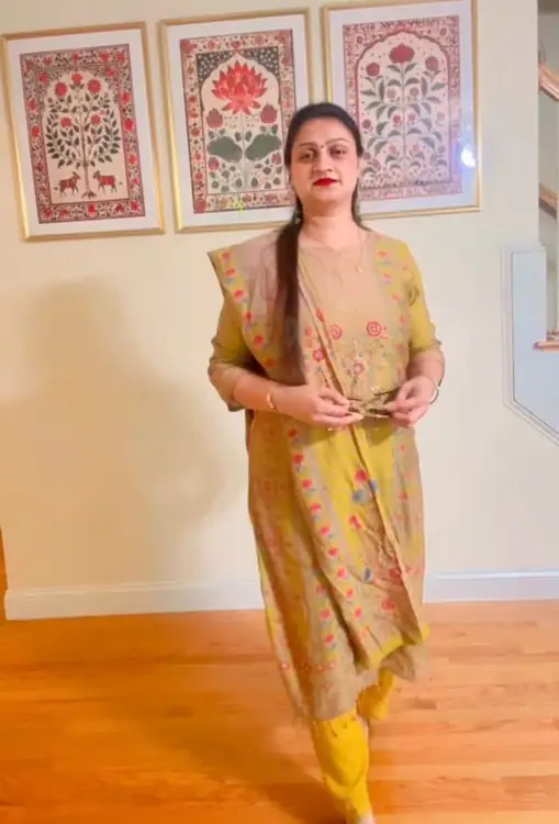 Customer in a mustard printed suit