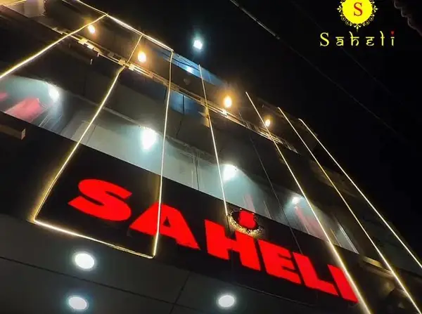Saheli showroom sign lit up at night